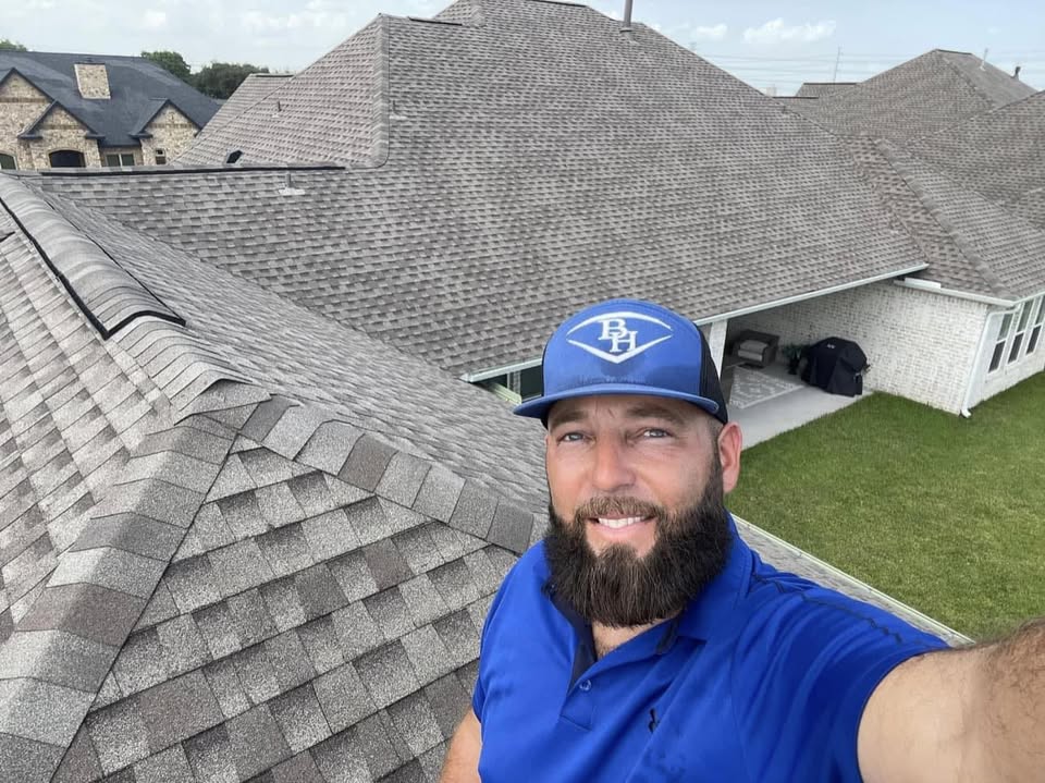 A crew member on a finished roof.